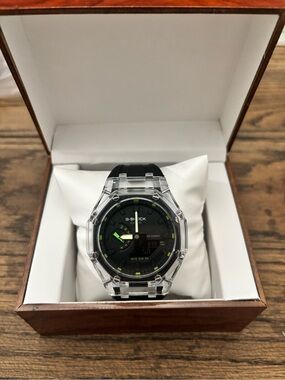 G-Shock Clear Case Black Dial Watch with Green Accents